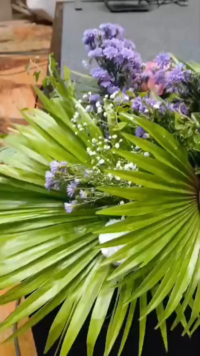 Greenery and purple floral arrangement