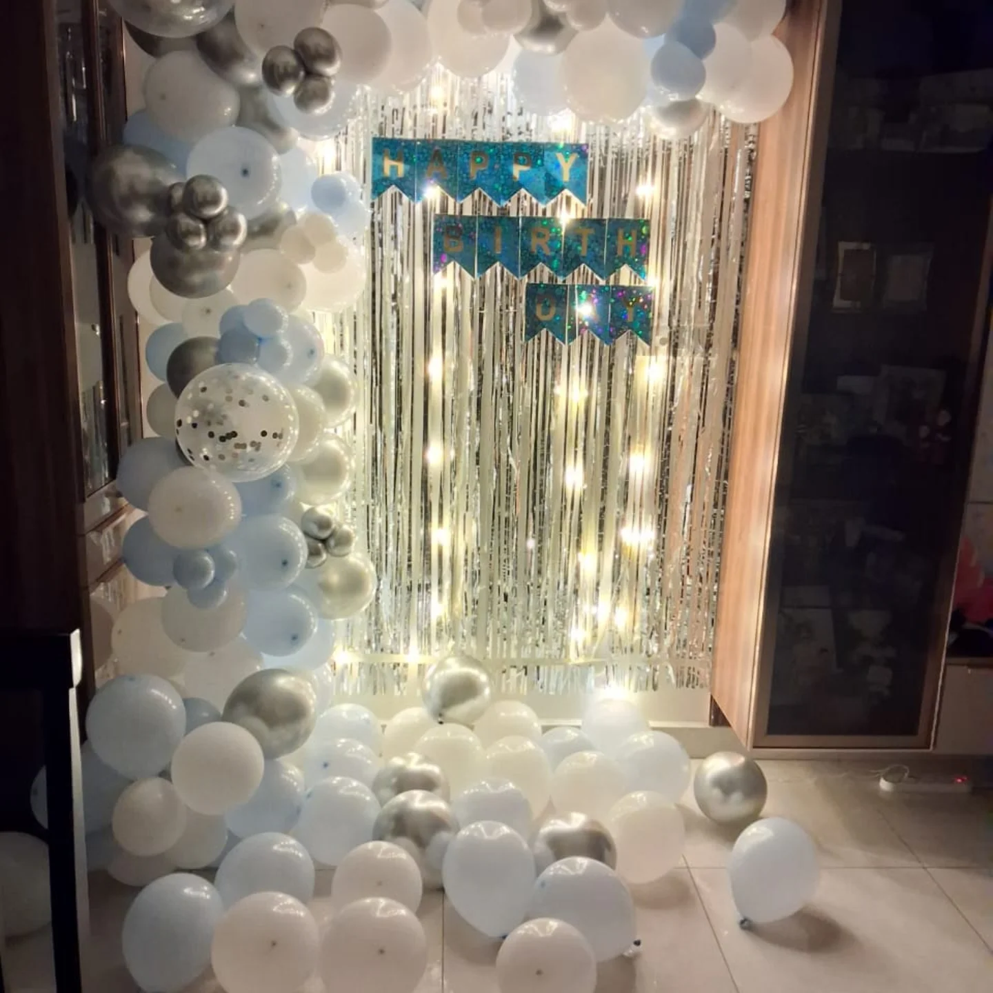 Silver and white birthday setup